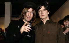 Liam-Gallagher-and-John-Squire-posing-together.jpg