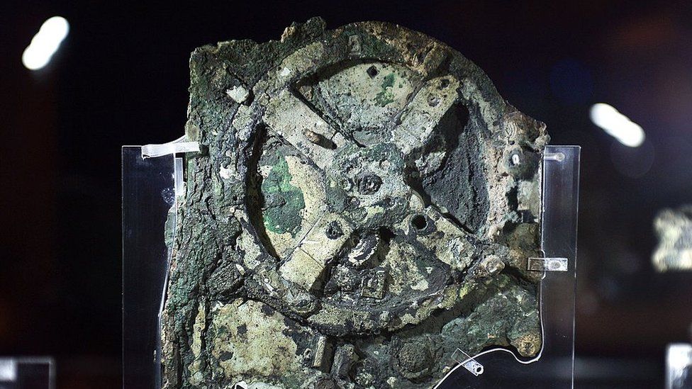 Image shows a piece of the Antikythera Mechanism at museum in Greece