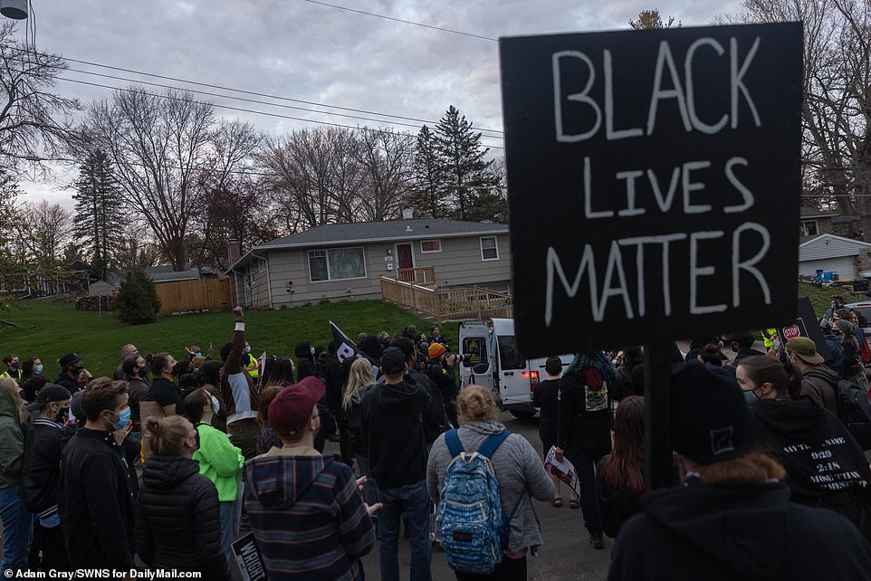 Protesters outside the home of Pete Orput, the Washington County Attorney in Stillwater on Saturday afternoon