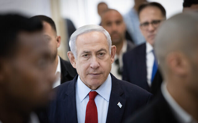 Prime Minister Benjamin Netanyahu arrives at the Jerusalem District Court for a hearing on his corruption trial, June 26, 2023. (Alex Kolomoisky/Pool)