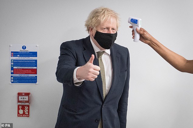 The decision by Prime Minister Boris Johnson (pictured having his temperature taken in North London earlier this month) to invest in four different vaccines was a masterstroke