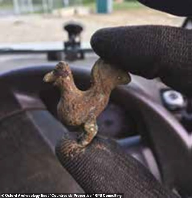 The village — built on a 'prominent ridge' overlooking the Brain valley — was likely of 'some importance' in the late Iron Age and early Roman period, the team said. Pictured, a copper alloy cockerel figurine, one of the numerous finds recovered from the Essex-based site The village — built on a 'prominent ridge' overlooking the Brain valley — was likely of 'some importance' in the late Iron Age and early Roman period, the team said. Pictured, a copper alloy cockerel figurine, one of the numerous finds recovered from the Essex-based site