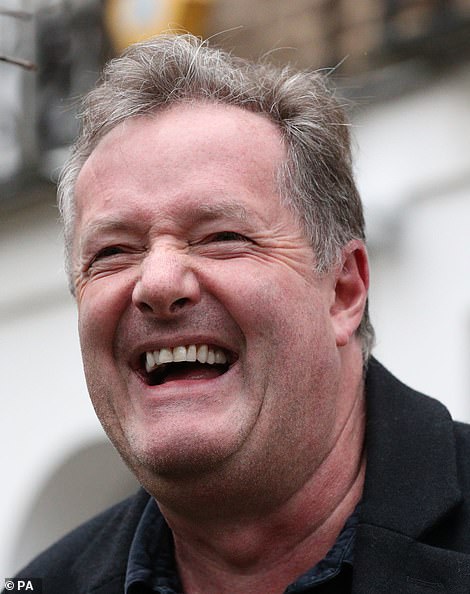 Piers Morgan laughs as he leaves his West London home today after quitting GMB in a row sparked by his comments about not believing Meghan Markle