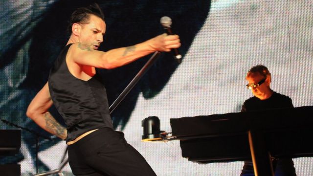 Dave Gahan (L) and Andrew Fletcher of Depeche Mode perform live on stage at the O2 Arena