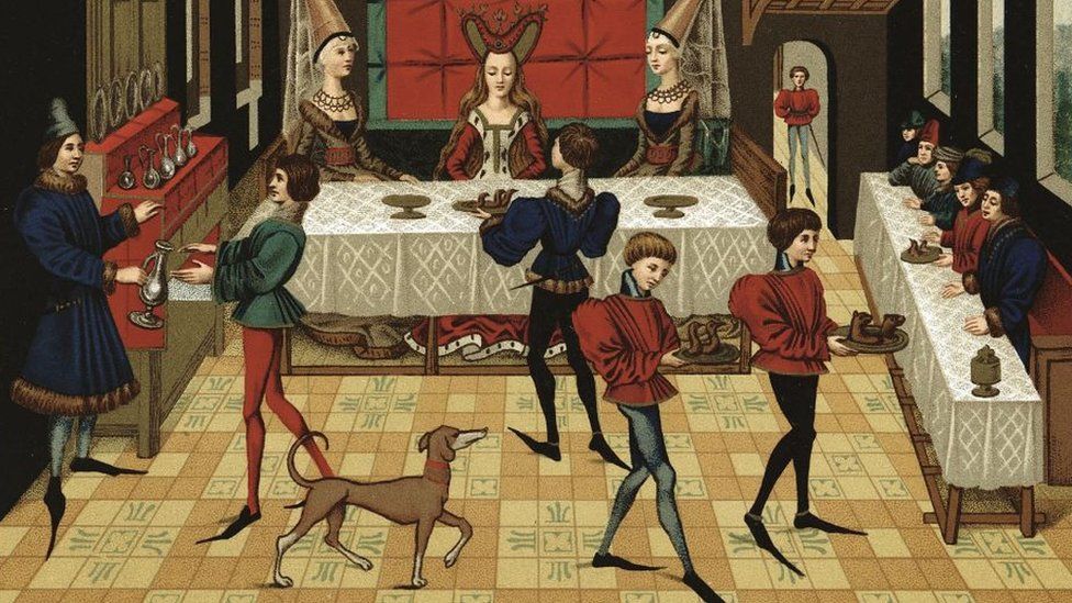 Servants wearing long pointed shoes serving French noblewomen, 15th Century