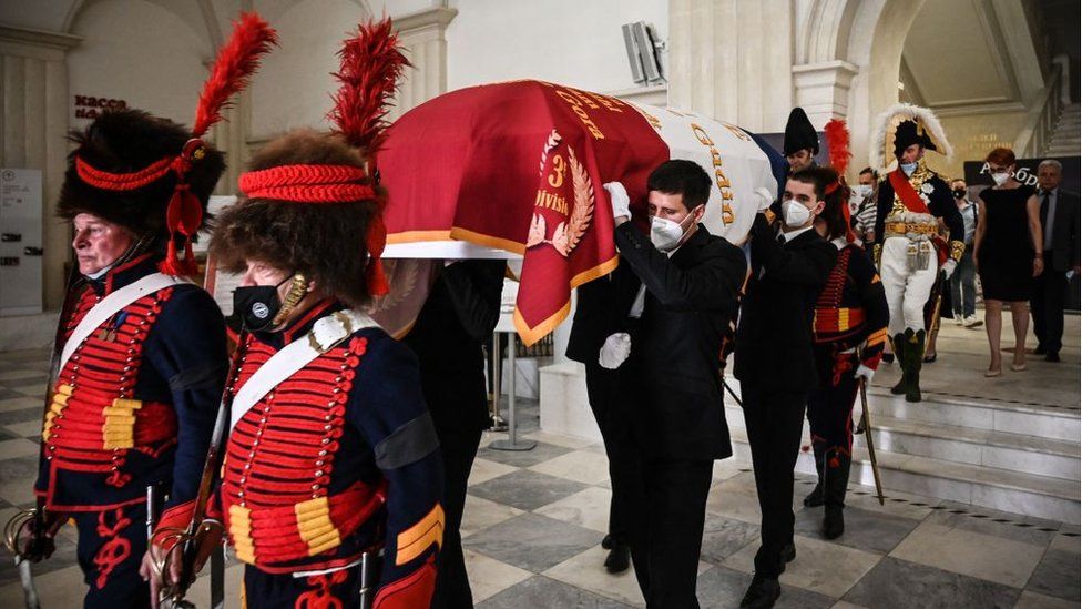 Members of a historical club and relatives carry the coffin of French General Charles Etienne Gudin during a ceremony to transfer the remains of his body from Russia to France