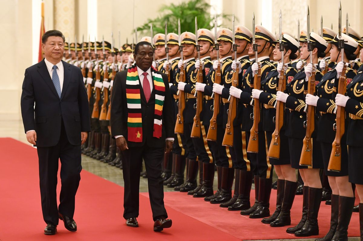 Zimbabwe's President Emmerson Mnangagwa reviews a military honor guard with Chinese leader Xi Jinping during a welcoming ceremony at the Great Hall of the People in Beijing on April 3, 2018. (Greg Baker/AFP/Getty Images)